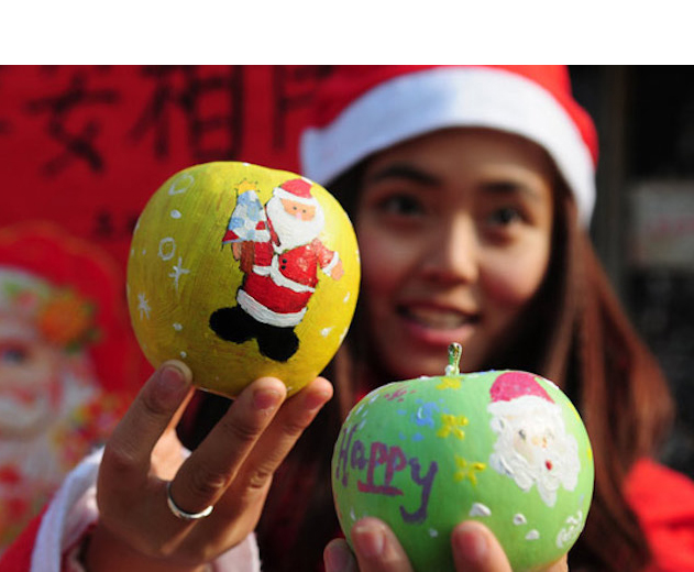 A girl giving Christmas apples in China